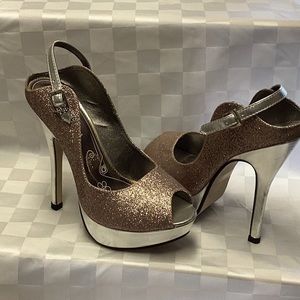 5 1/2 inch heels. Silver heel, platform and strap. Body is glittery. Open toed.